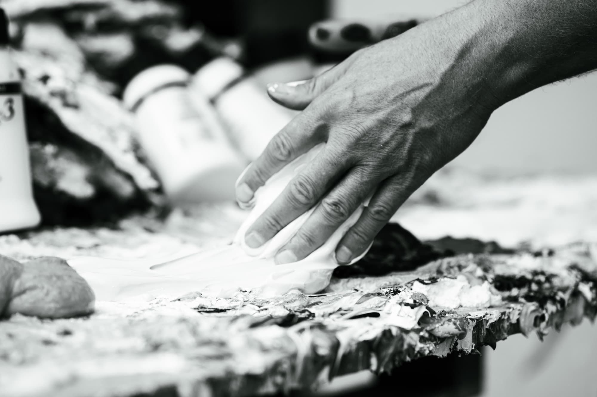 Hand working the paint